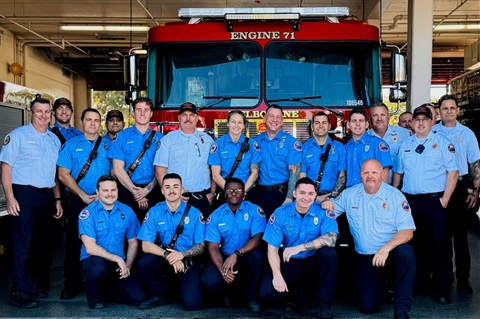 Group of firefighters in front of Engine 71