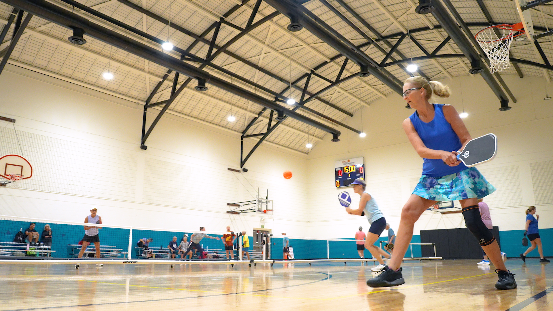 Group of people playing pickleball on an indoor court at Eau Gallie Civic Center