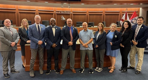 Peter Kostrzewa with City staff and Council members in the Council Chamber after the presentation of his Volunteer Service Milestone Award. 