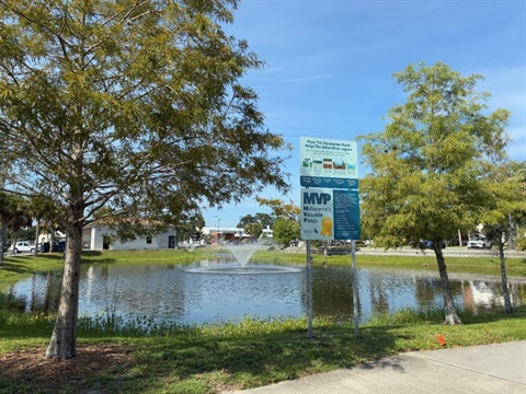 Stormwater pond on Florida Tech's campus with MVP sign