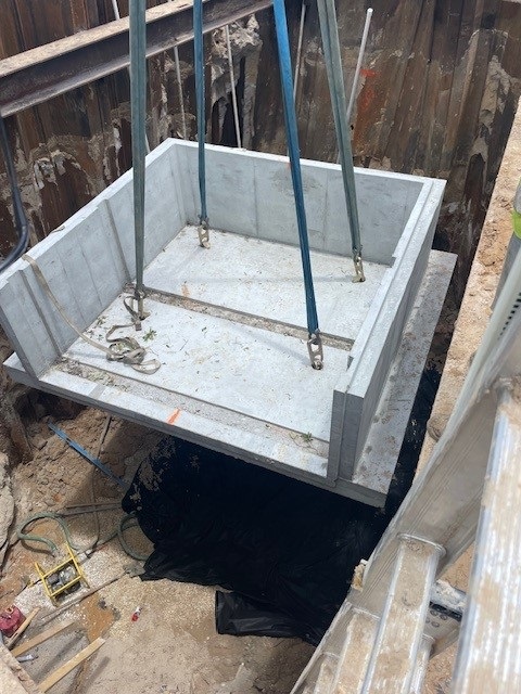Cherry Street baffle box being lowered into the ground