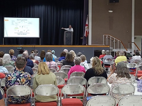 Sally Sclera gives a presentation as attendees watch at the Florida Friendly Landscaping Seminar