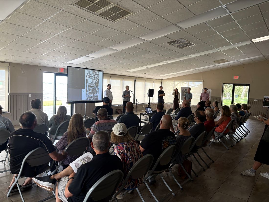Community Development Director speaking to attendees of the design presentation