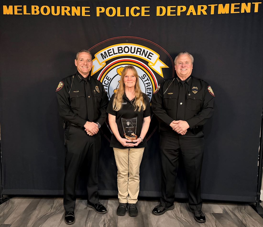 Communications Officer of the Year Wendy Luszczewski with Deputy Chief Waltemeyer and Chief Gillespie