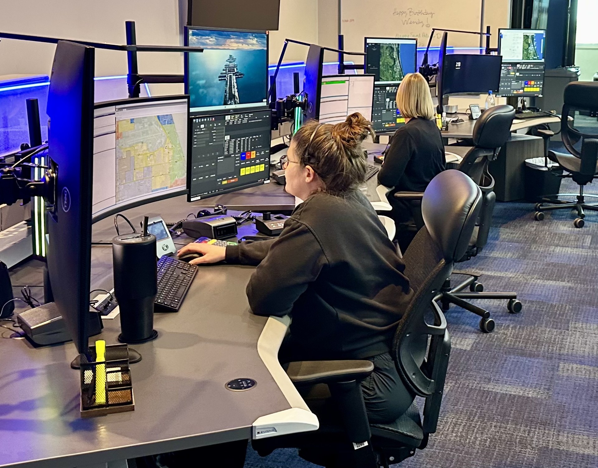Communications officers looking at monitors